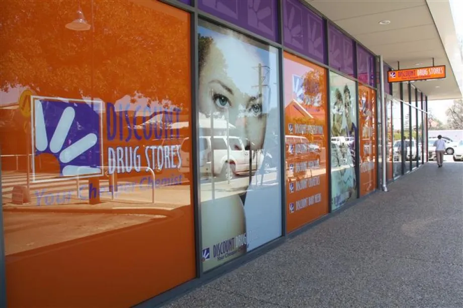 Discount Drug Stores shopfront windows covered in printed vinyl graphics