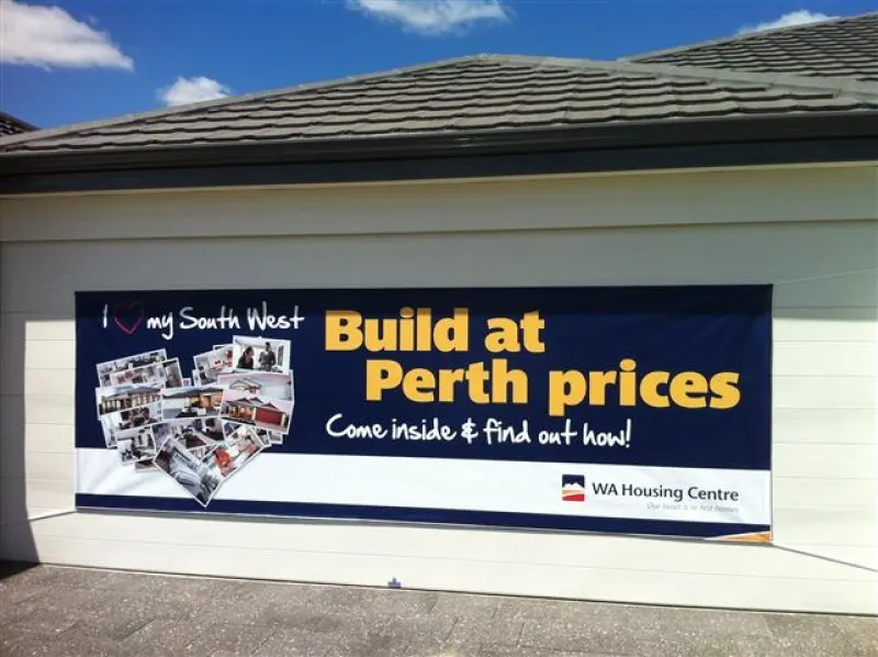 WA Housing Centre Build at Perth prices banner on a garage wall