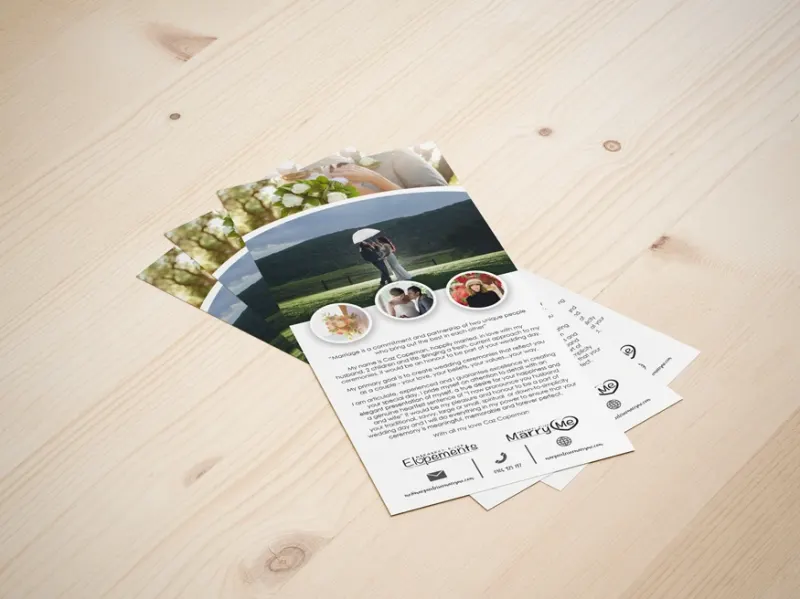 Printed flyers fanned out on a timber table