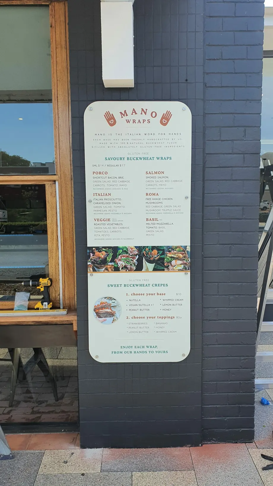 Menu board mounted on a dark pillar