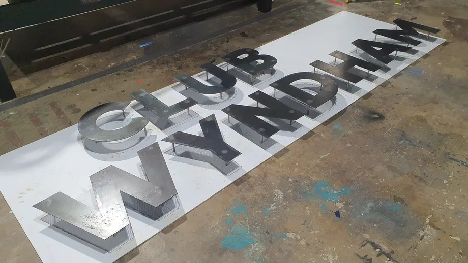 Club Wyndham dimensional letters laid out in the workshop before installation