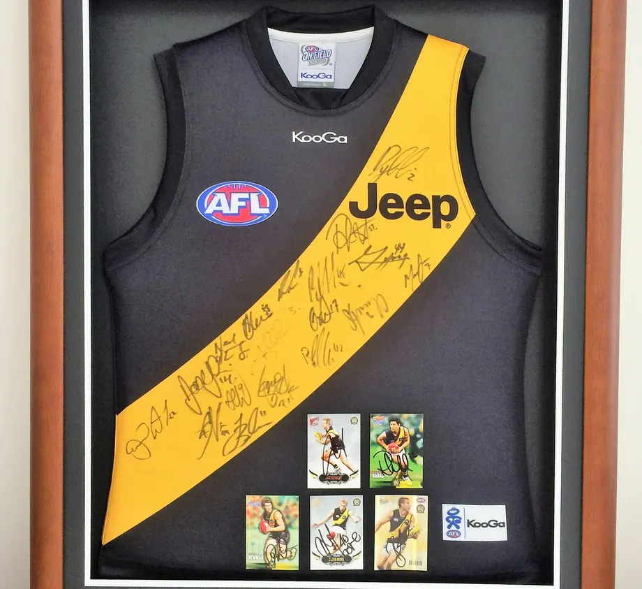 Signed Richmond AFL jersey framed with player cards