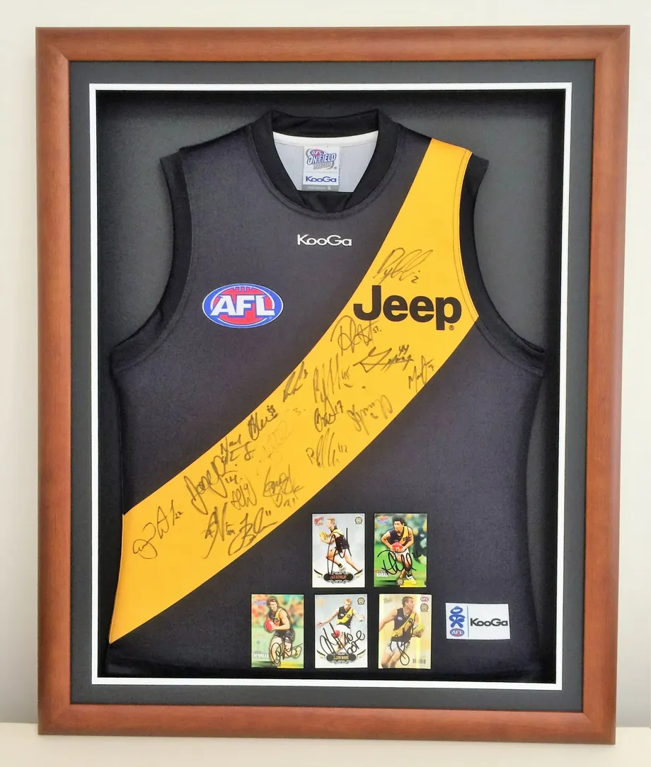 Signed Richmond AFL jersey in a timber shadow box frame