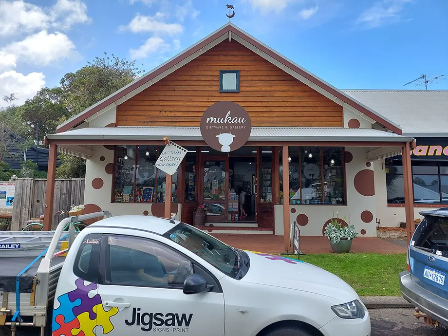 Jigsaw Signs + Print ute parked outside a shop