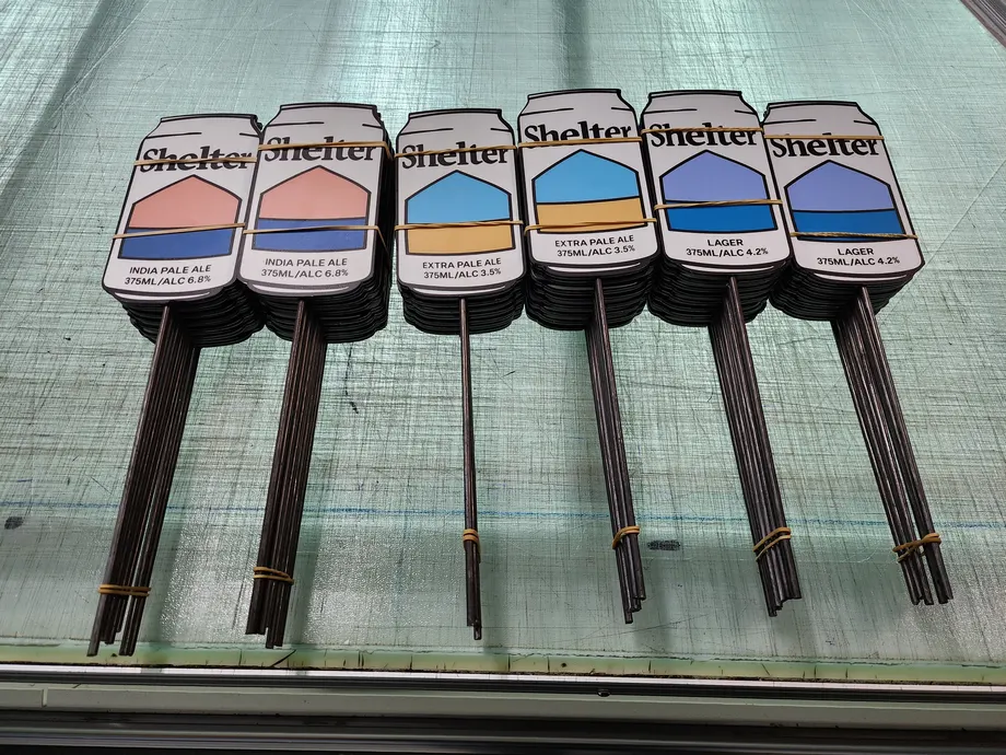 Shelter shaped corflute signs on stakes