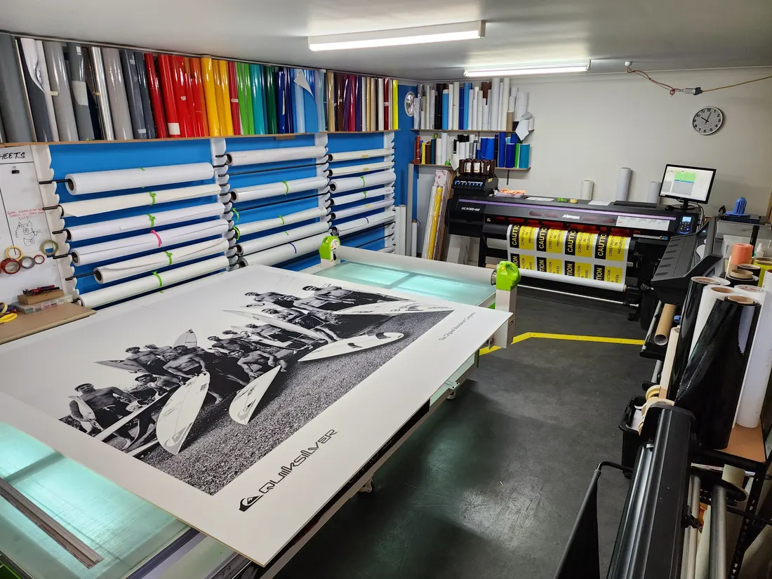 Large black and white print on the Jigsaw Signs + Print workshop table