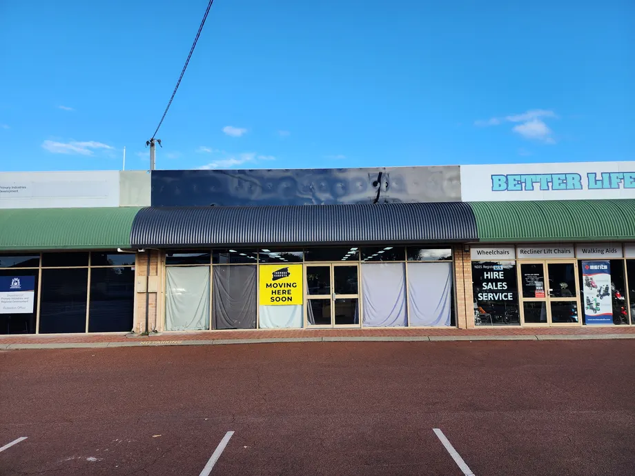 Trevors Carpets shopfront with the old fascia removed