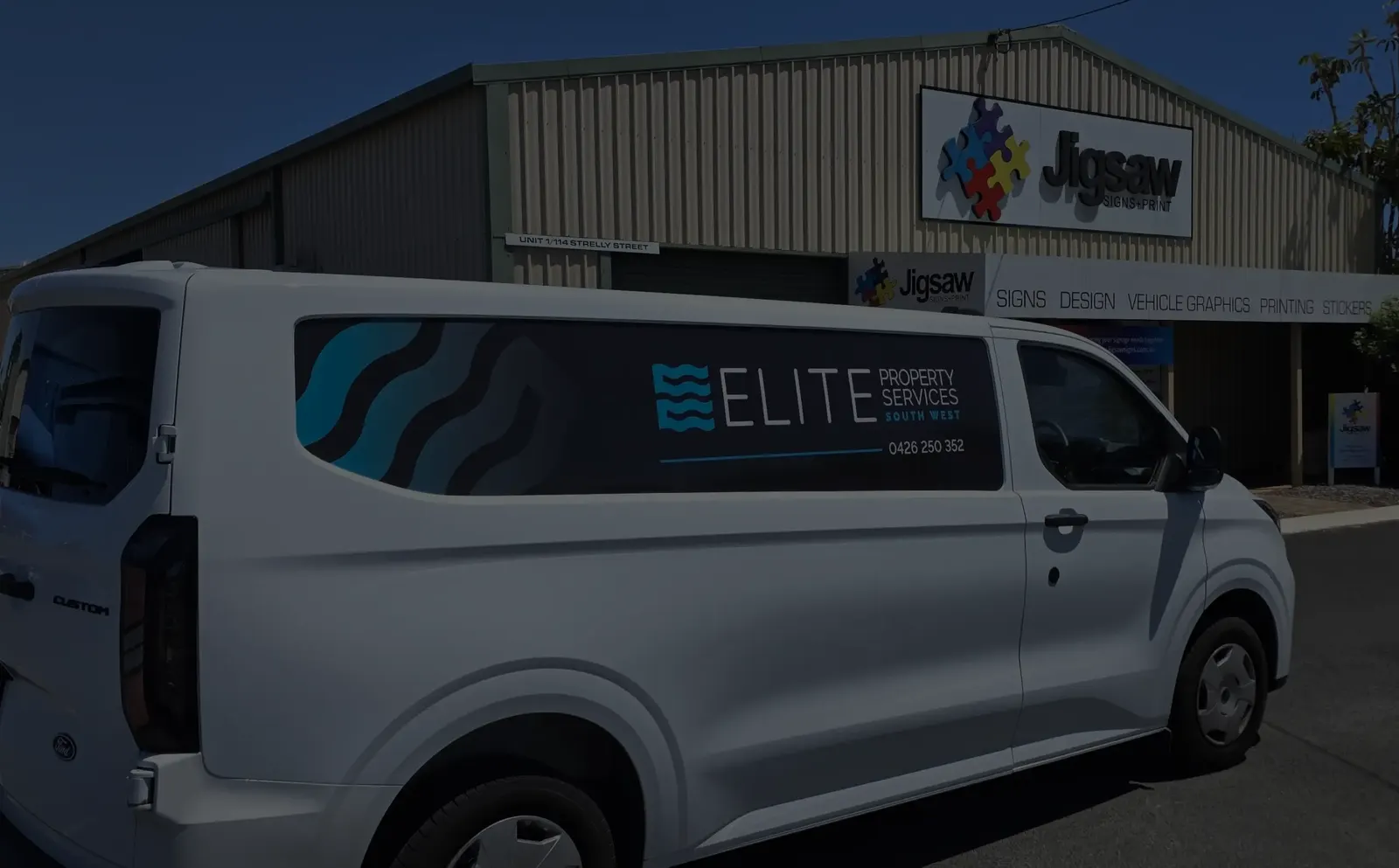 White van with Elite Property Services vehicle graphics outside the Jigsaw Signs + Print workshop