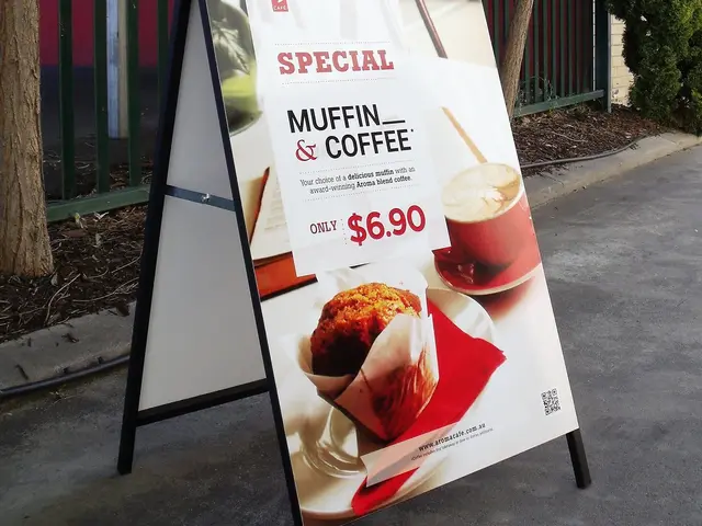Metal-faced A-frame sign advertising a muffin and coffee special