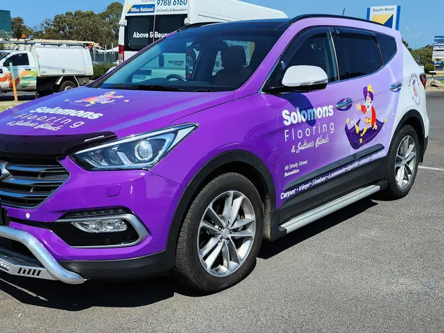 Purple Solomons Flooring SUV with full vehicle graphics